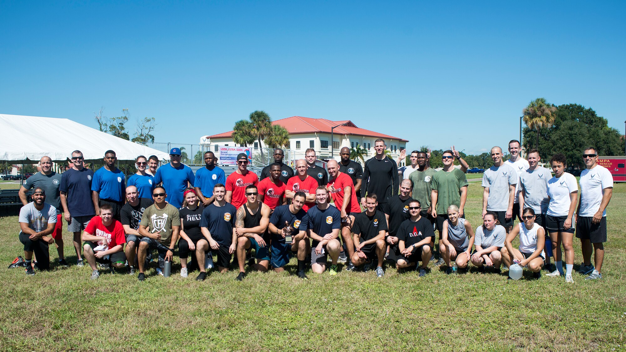 Participants in the 2018 Fire Muster as part of Fire Prevention Week pause for a photo at MacDill Air Force Base, Fla., Oct. 12, 2018.