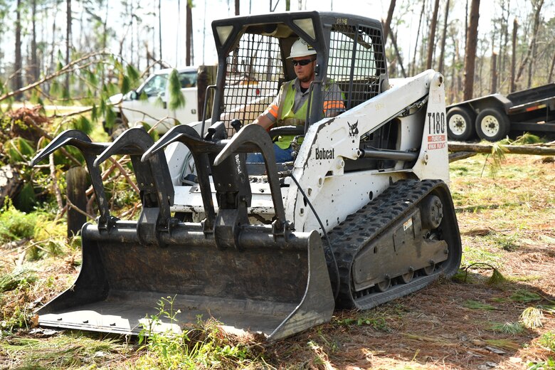 A U.S. Army Corps of Engineers Mobile District contractor cleans up fallen trees and other debris from Hurricane Michael at the Lake Seminole Project Oct. 16, 2018. USACE Mobile District Commander Col. Sebastien P. Joly visited the Lake Seminole Project Office and Jim Woodruff Lock and Dam to meet employees, hand out supplies and observe the recovery effort.