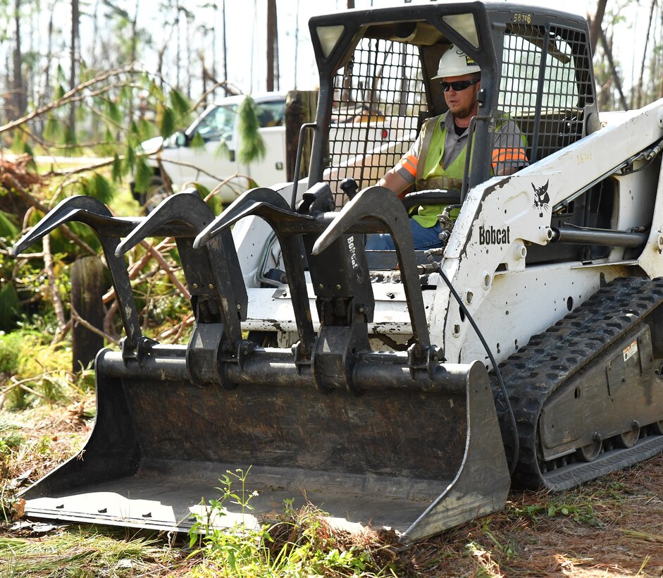 A U.S. Army Corps of Engineers Mobile District contractor cleans up fallen trees and other debris from Hurricane Michael at the Lake Seminole Project Oct. 16, 2018. USACE Mobile District Commander Col. Sebastien P. Joly visited the Lake Seminole Project Office and Jim Woodruff Lock and Dam to meet employees, hand out supplies and observe the recovery effort.