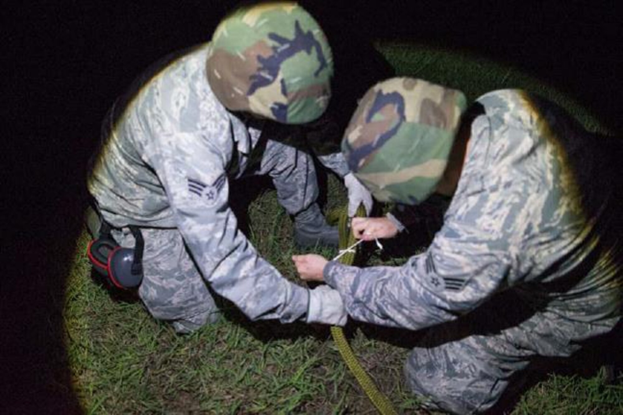 Senior Airman Juan Romero (left) and Senior Airman Samuel Gordon, aerial transportation technicians, 26 Aerial Port Squadron