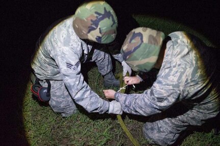Senior Airman Juan Romero (left) and Senior Airman Samuel Gordon, aerial transportation technicians, 26 Aerial Port Squadron