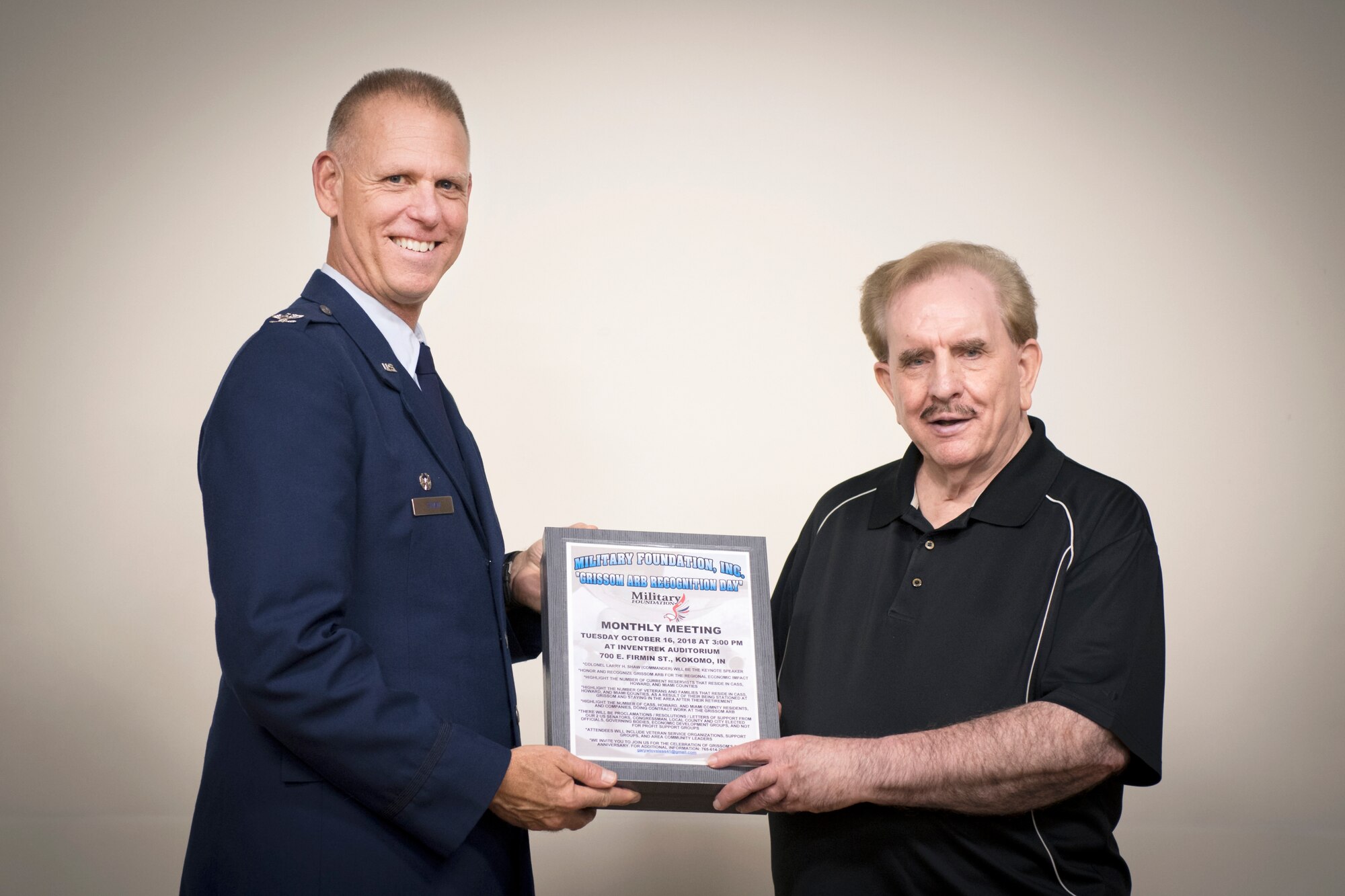 Col. Larry Shaw, 434th Air Refueling Wing commander, is presented a box full of proclamations from government and civic organizations, by Gary Loveless from the Military Foundation, Inc., during a Grissom Appreciation Day event
at the Iventrek Auditorium in Kokomo, Ind., Oct. 16, 2018. Shaw provided the overview of Grissom, and answered questions as part of the event. (U.S. Air Force photo/Master Sgt. Benjamin Mota)
