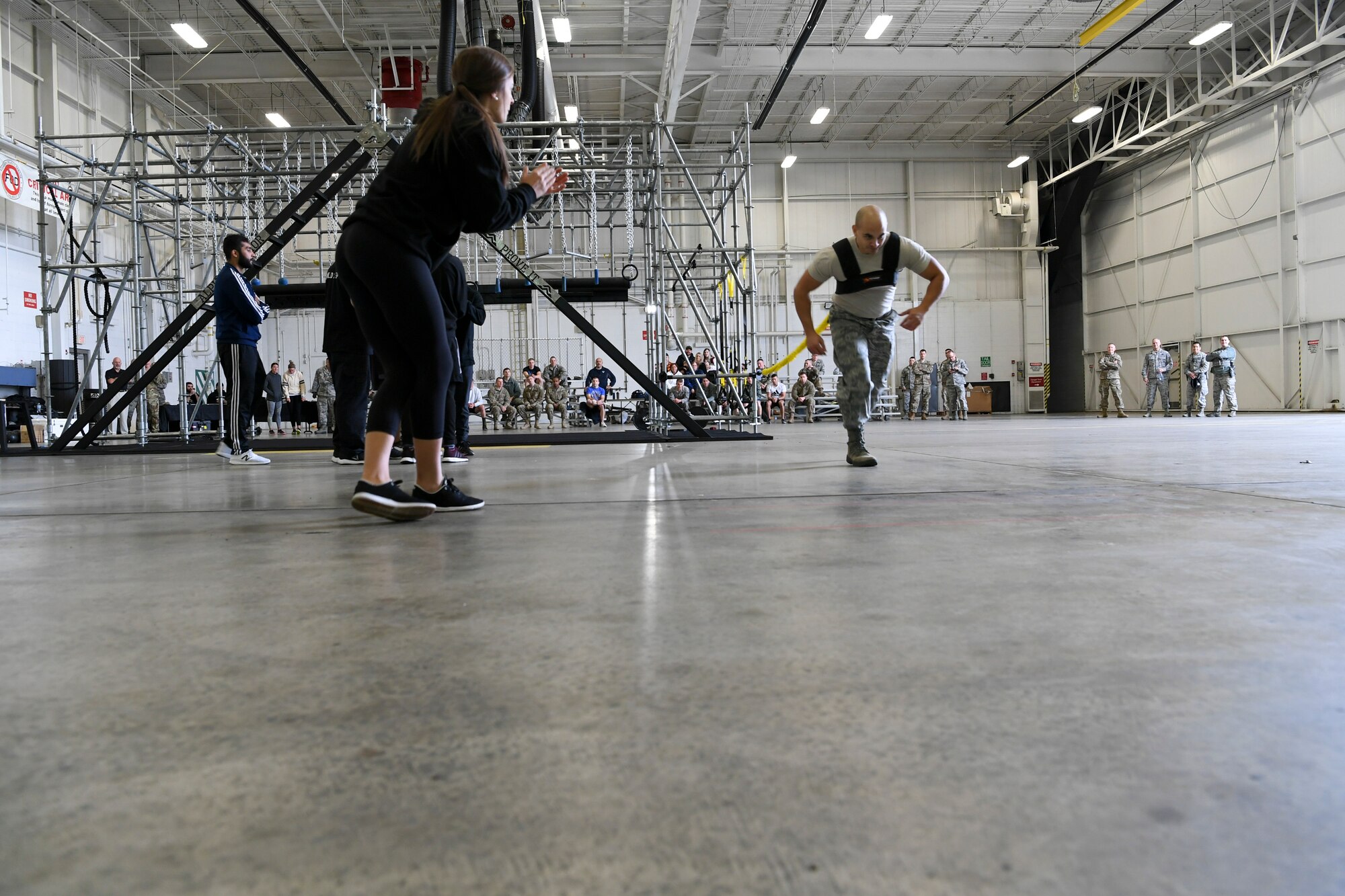 An Airman with the 911th Airlift Wing participates in a time challenge using the Alpha Warrior Battle Rig at the Pittsburgh International Airport Air Reserve Station, Pennsylvania, October 14, 2018. The battle rig is designed to meet all four of the Comprehensive Airman Fitness model's pillars: mental, physical, social and spiritual. (U.S. Air Force photo by Staff Sgt. Zachary Vucic)