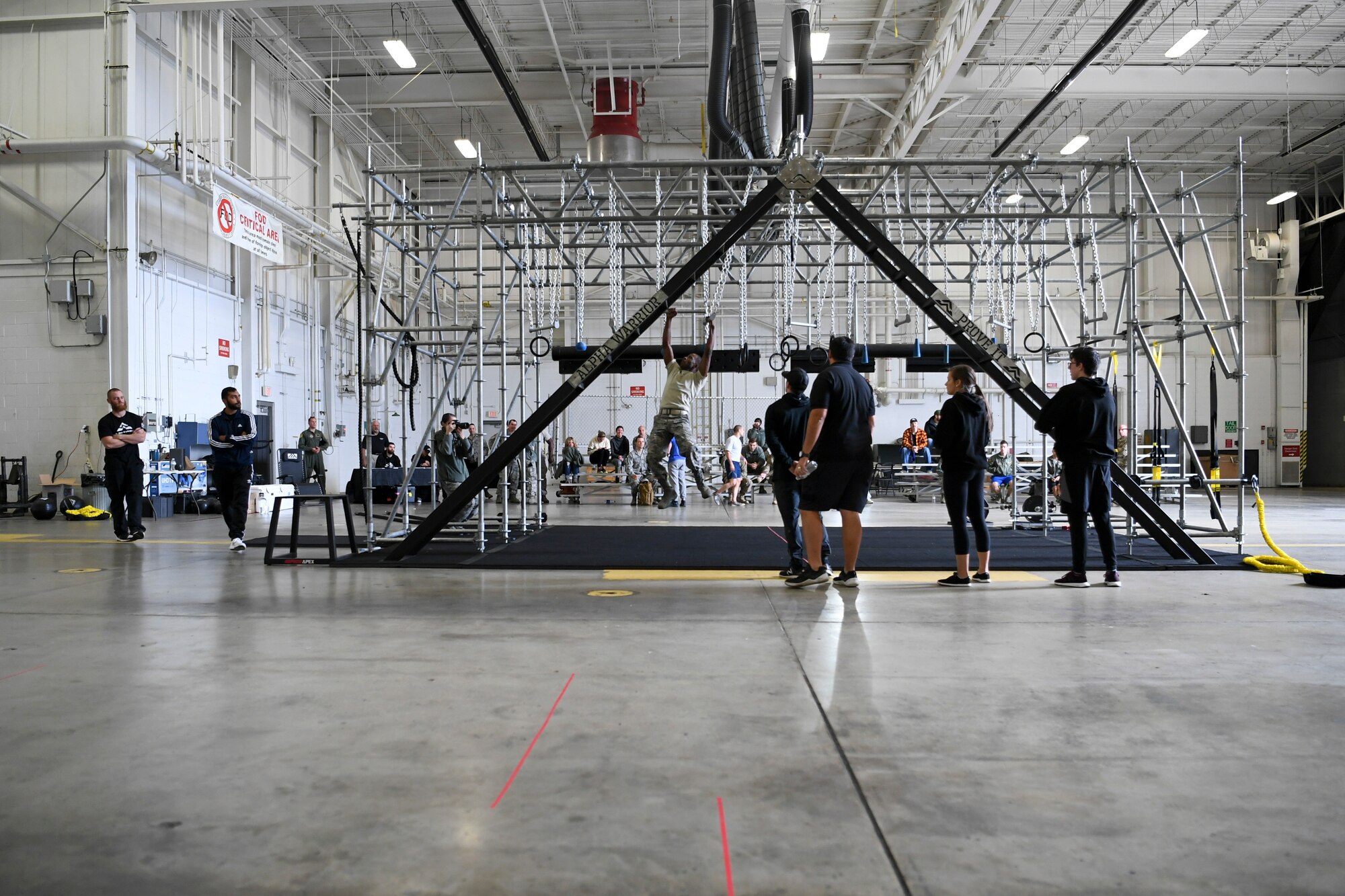An Airman with the 911th Airlift Wing participates in a time challenge using the Alpha Warrior Battle Rig at the Pittsburgh International Airport Air Reserve Station, Pennsylvania, October 14, 2018. The battle rig is designed to meet all four of the Comprehensive Airman Fitness model's pillars: mental, physical, social and spiritual. (U.S. Air Force photo by Staff Sgt. Zachary Vucic)
