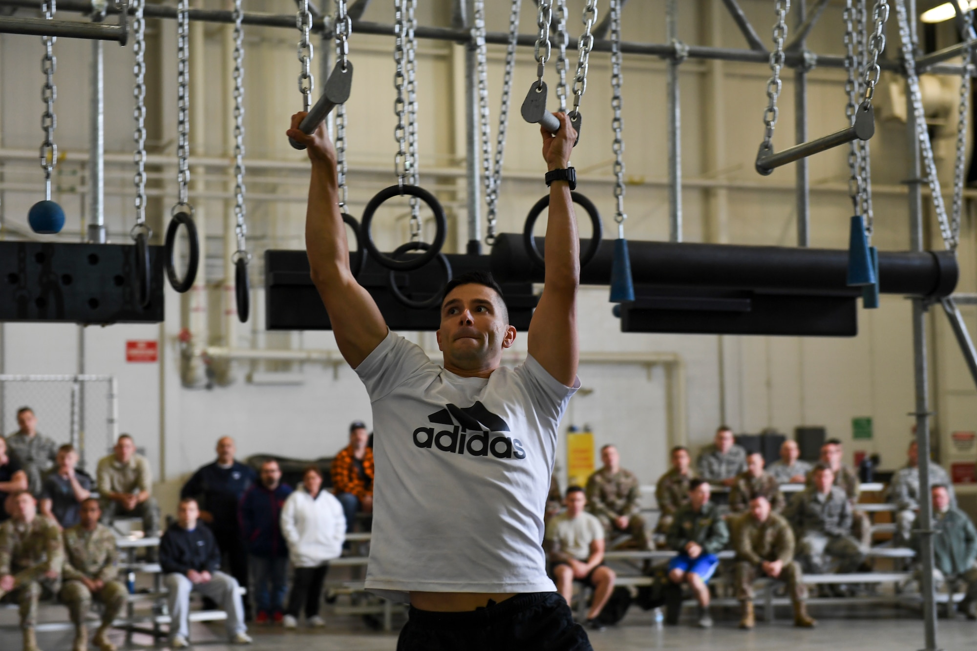 An Airman with the 911th Airlift Wing participates in a time challenge using the Alpha Warrior Battle Rig at the Pittsburgh International Airport Air Reserve Station, Pennsylvania, October 14, 2018. The battle rig is designed to meet all four of the Comprehensive Airman Fitness model's pillars: mental, physical, social and spiritual. (U.S. Air Force photo by Senior Airman Beth Kobily)