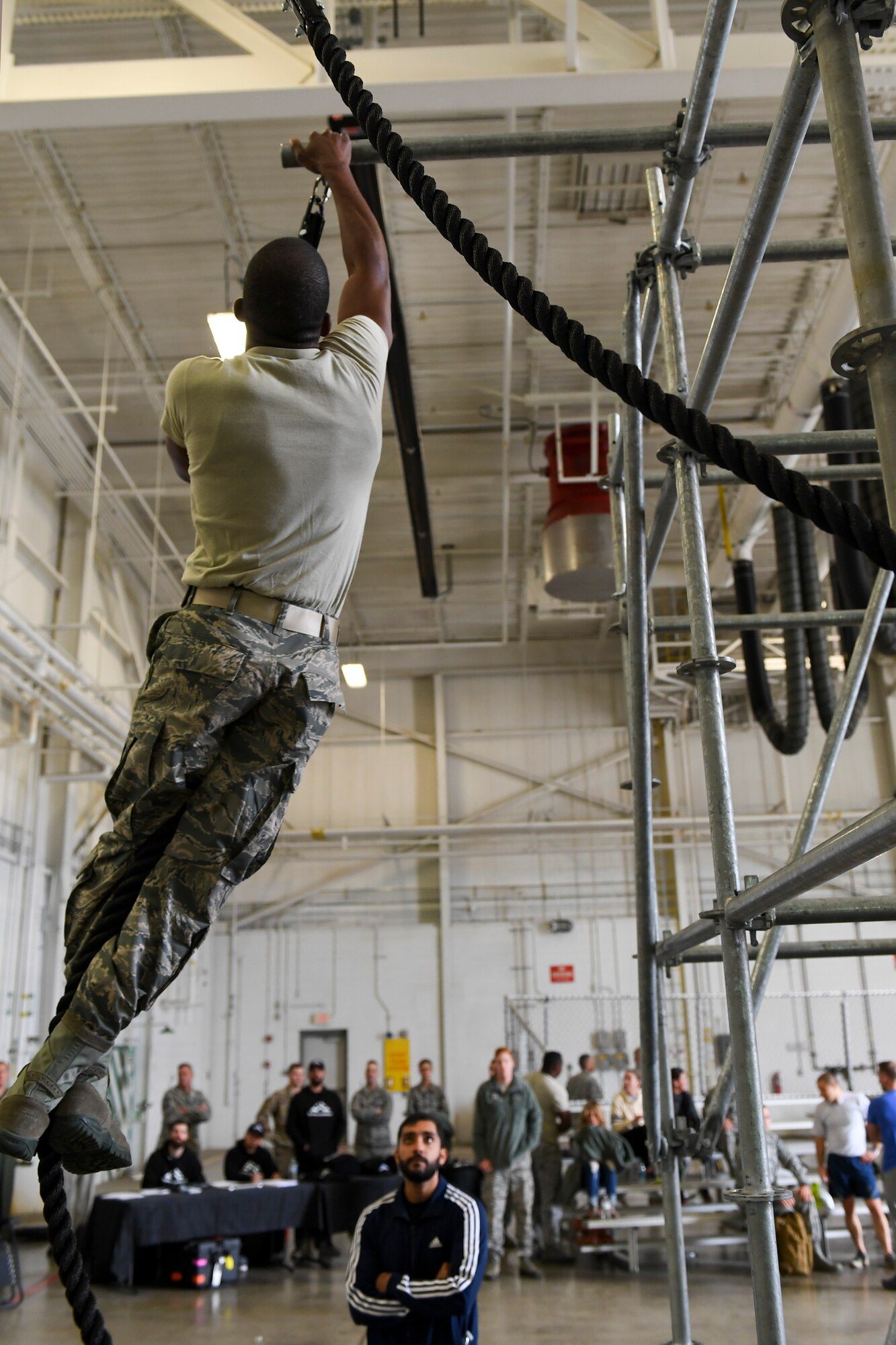 An Airman with the 911th Airlift Wing participates in a time challenge using the Alpha Warrior Battle Rig at the Pittsburgh International Airport Air Reserve Station, Pennsylvania, October 14, 2018. The battle rig is designed to meet all four of the Comprehensive Airman Fitness model's pillars: mental, physical, social and spiritual. (U.S. Air Force photo by Senior Airman Beth Kobily)