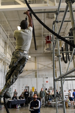 An Airman with the 911th Airlift Wing participates in a time challenge using the Alpha Warrior Battle Rig at the Pittsburgh International Airport Air Reserve Station, Pennsylvania, October 14, 2018. The battle rig is designed to meet all four of the Comprehensive Airman Fitness model's pillars: mental, physical, social and spiritual. (U.S. Air Force photo by Senior Airman Beth Kobily)