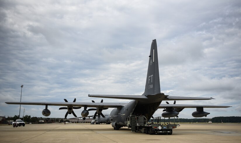 A HC-130J Combat King II from the 71st Rescue Squadron at Moody Air Force Base, Georgia, is loaded by U.S. Air Force Airmen from the 733rd Logistics Readiness Squadron with gear and supplies at Joint Base Langley-Eustis, Virginia, Oct. 17, 2018. The supplies and gear being loaded are for recovery efforts of Tyndall Air Force Base, Florida. (U.S. Air Force photo by Staff Sgt. Carlin Leslie/Released)