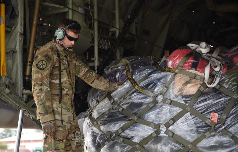 U.S. Air Force Airman First Class Jack Faught, 71st Rescue Squadron loadmaster, waits for orders after loading a HC-130J Combat King II at Joint Base Langley-Eustis, Virginia, Oct. 17,2018. The 71st RQS is supporting recovery efforts at Tyndall Air Force Base, Florida. (U.S. Air Force photo by Staff Sgt. Carlin Leslie/Released)
