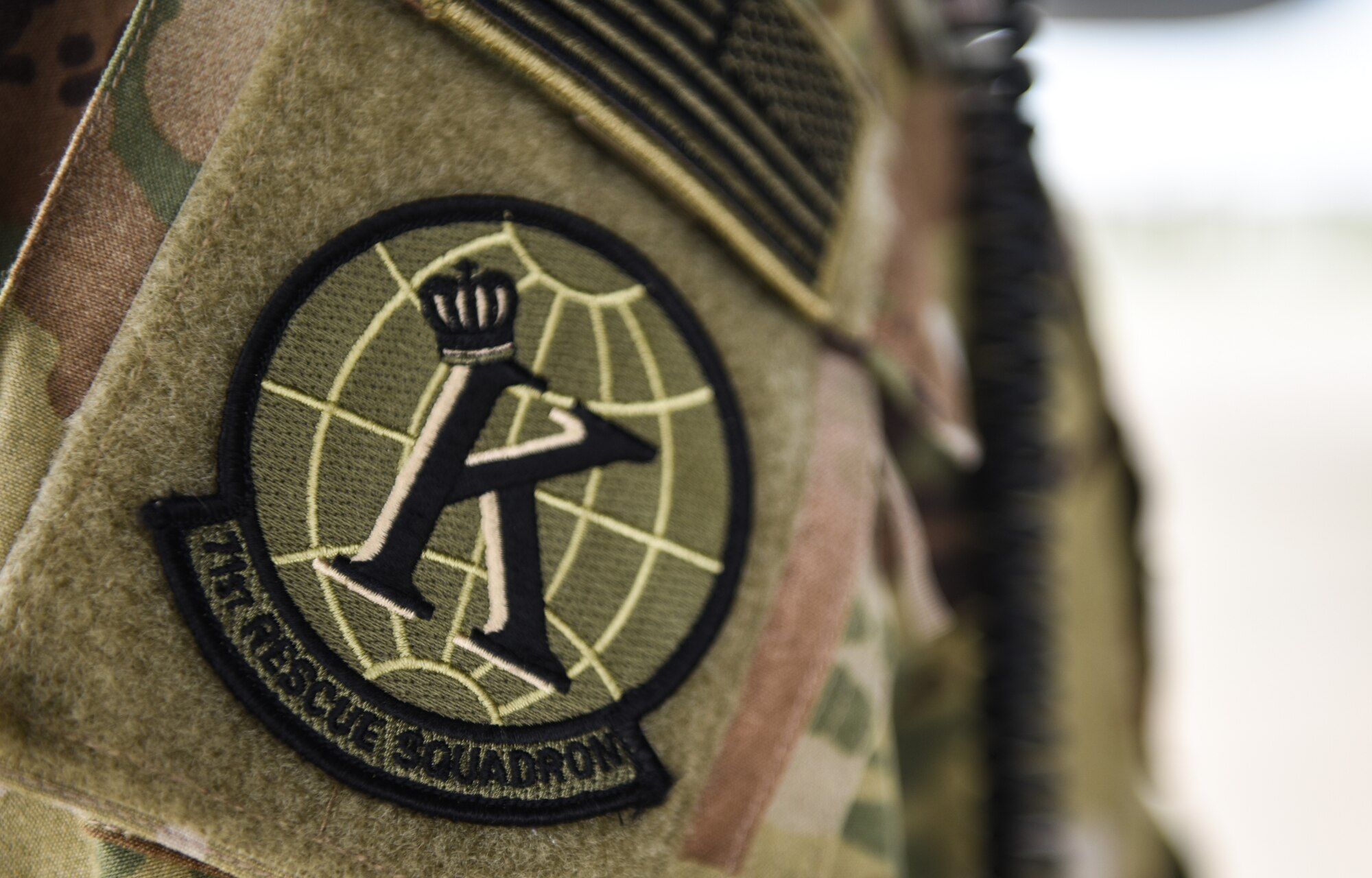 The U.S. Air Force 71st Rescue Squadron patch is on the shoulder of U.S. Air Force Airman First Class Jack Faught, 71st RQS loadmaster during loading operations at Joint Base Langley-Eustis, Virginia, Oct. 17, 2018. The 71st RQS is out of Moody Air Force Base, Georgia, supporting Tyndall Air Force Base, Florida, recovery efforts. (U.S. Air Force photo by Staff Sgt. Carlin Leslie/Released)