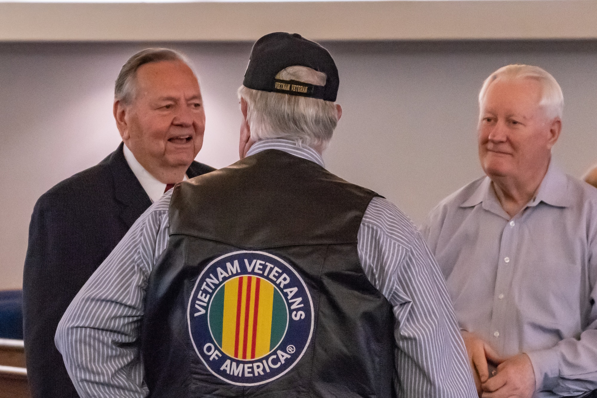 David Miller talks with friends at a ceremony where he was presented the Distinguished Flying Cross Award at Nacogdoches, Texas, Oct. 13, 2018. Miller earned the award for his actions during a tour in the Vietnam War. (U.S. Air Force photo by Tech. Sgt. Cody Burt/Released)