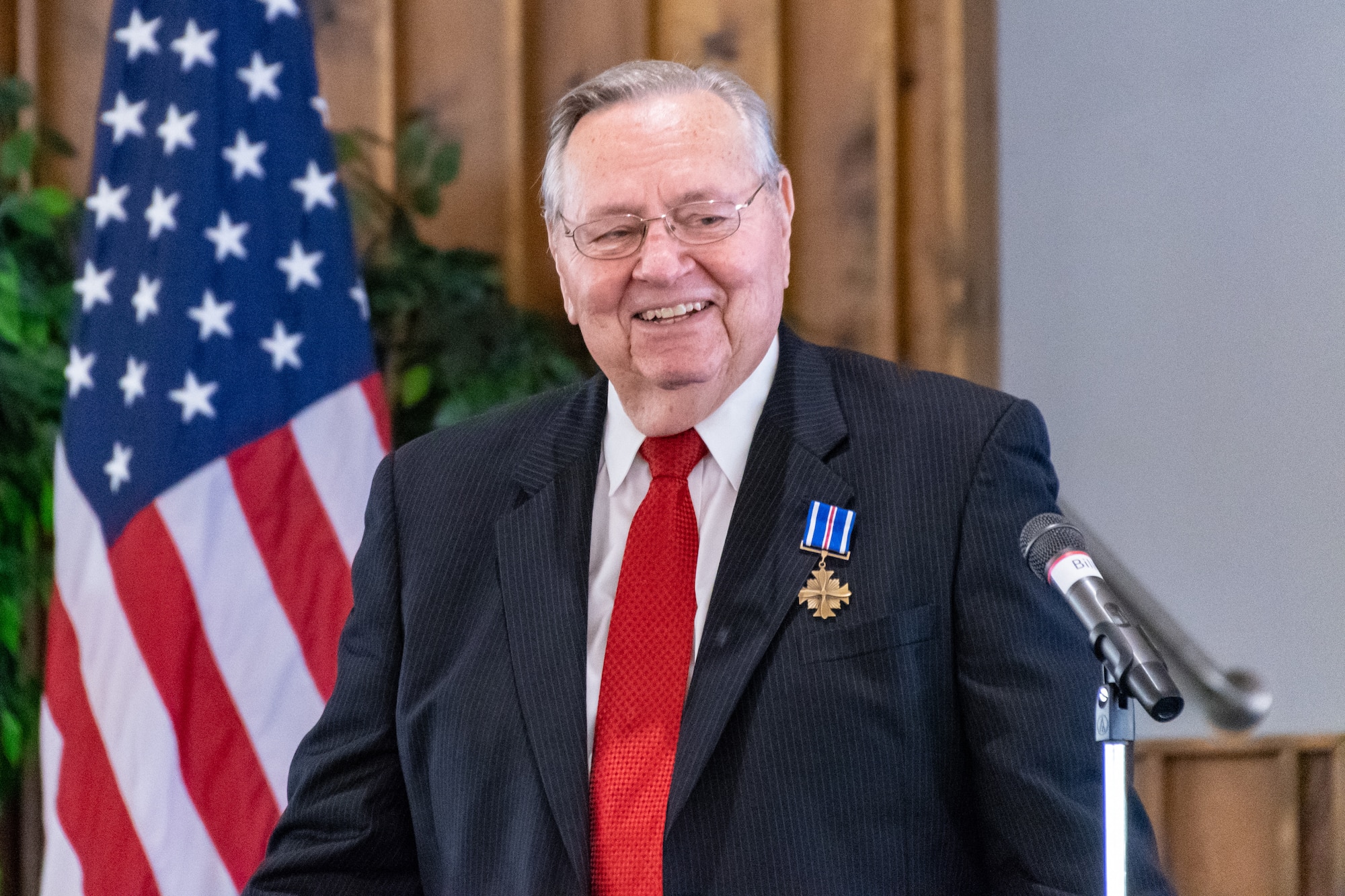David Miller smiles as he gives a speech after being presented the Distinguished Flying Cross Award at Nacogdoches, Texas, Oct. 13, 2018. This presentation came 50 years after he earned the award for his actions during a tour in the Vietnam War. During his time there, he intercepted enemy radio communications that saved countless American lives. (U.S. Air Force photo by Tech. Sgt. Cody Burt/Released)
