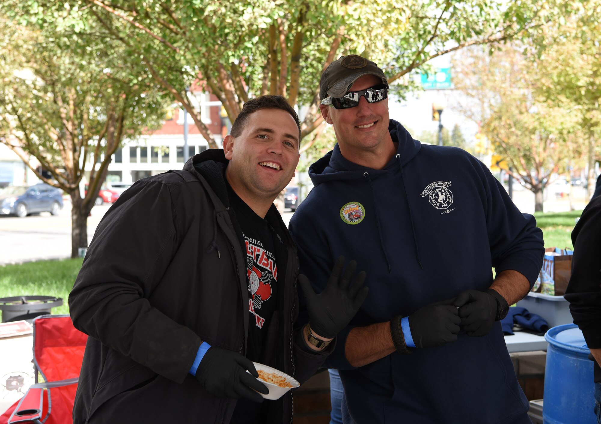 Two members of the local fire department pose for a picture. The local community enjoys the festivities during the Fire Prevention Week Open House in Cheyenne, Wyo., Oct. 13, 2018.