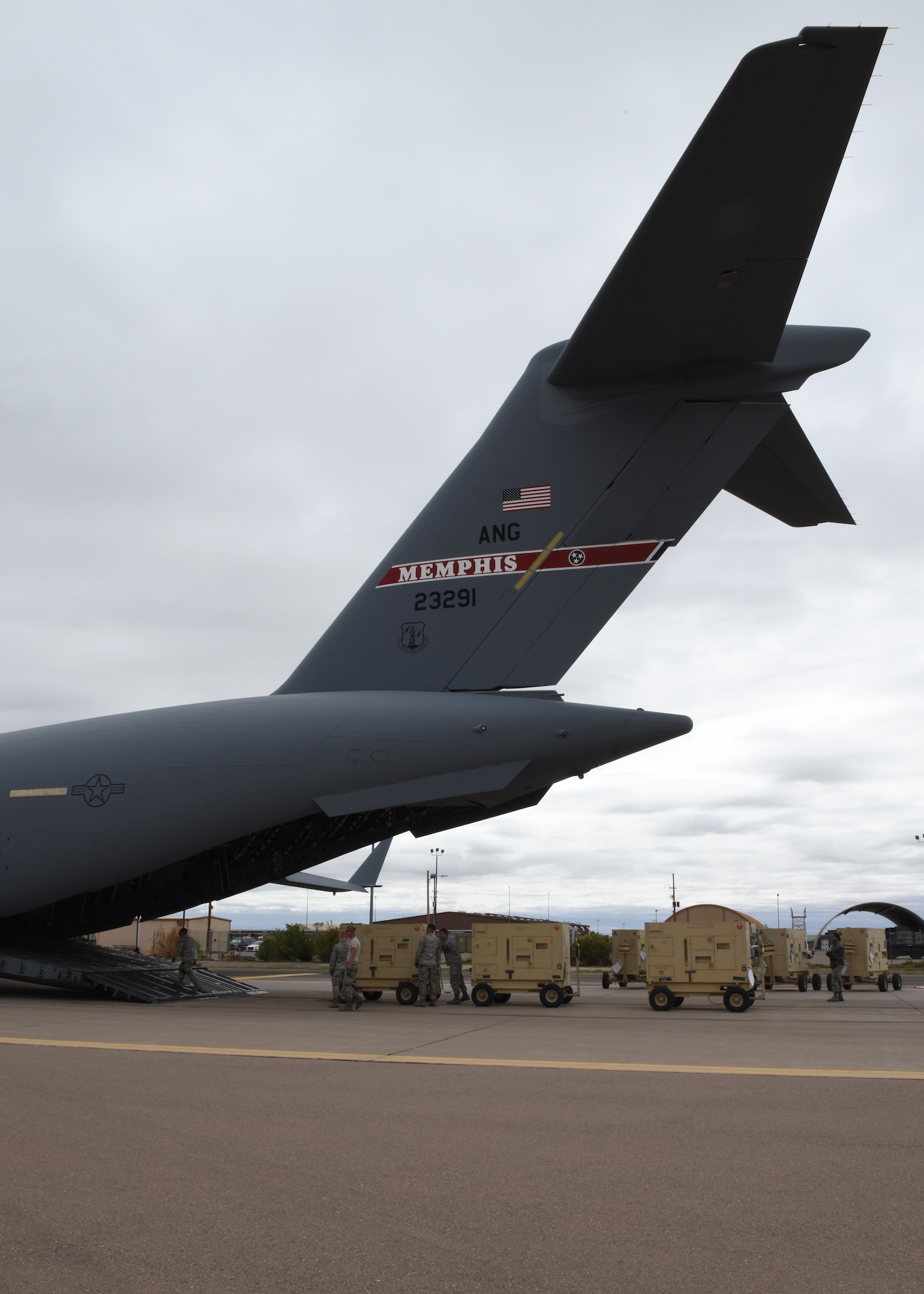 Airmen from the 49th Logistics Readiness Squadron and the 635th Materiel Maintenance Group lock equipment into place, Oct. 15, 2018, on a C-17 Globemaster III, assisted to the Memphis Air National Guard, on the flightline at Holloman Air Force Base, N.M. The 49th LRS supported Airmen from the 635th MMG in a recent operation to send essential supplies to Tyndall Air Force Base, Fla. (U.S. Air Force photo by Airman Autumn Vogt)