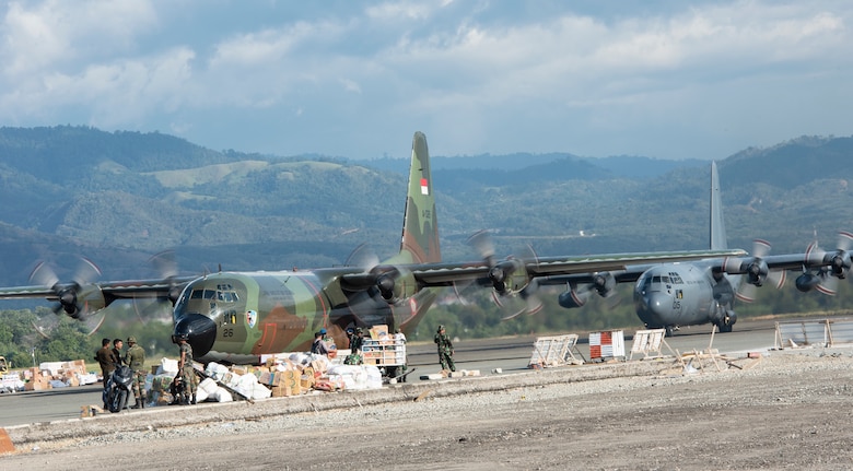 Two C-130s from the Indonesian and Royal New Zealand Air Force lands at the airport in Palu, Indonesia Oct. 10, 2018. As of Oct. 15, 2018, military members assigned to the 374th Airlift Wing from Yokota Air Base, Japan and the 36th Contingency Response Group have transported and offloaded over 543,373 lbs. of humanitarian supplies in Balikpapan, as well as 255 passengers. Collectively the U.S. Air Force and our multinational partners have downloaded 1,534,140 lbs. of cargo and transported 333 displaced people from Palu, Indonesia. (U.S. Air Force photo by Master Sgt. JT May III)