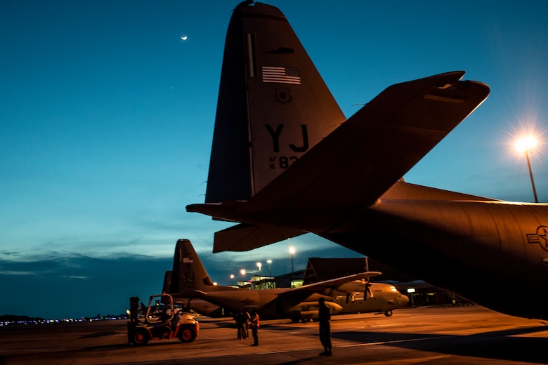 Three U.S. C-130 Hercules aircraft rest on the flight line in Balikpapan, Indonesia Oct. 12, 2018. Pilots, aircrew and security forces members from the 374th Airlift Wing and 36th Airlift Squadron have flown up to three sorties daily to ensure humanitarian supplies reach thousands. More than 543,373 lbs. of supplies have been transported on U.S. aircraft, 255 passengers and approximately 47 displaced people from Palu. (U.S. Air Force photo by Master Sgt. JT May III)