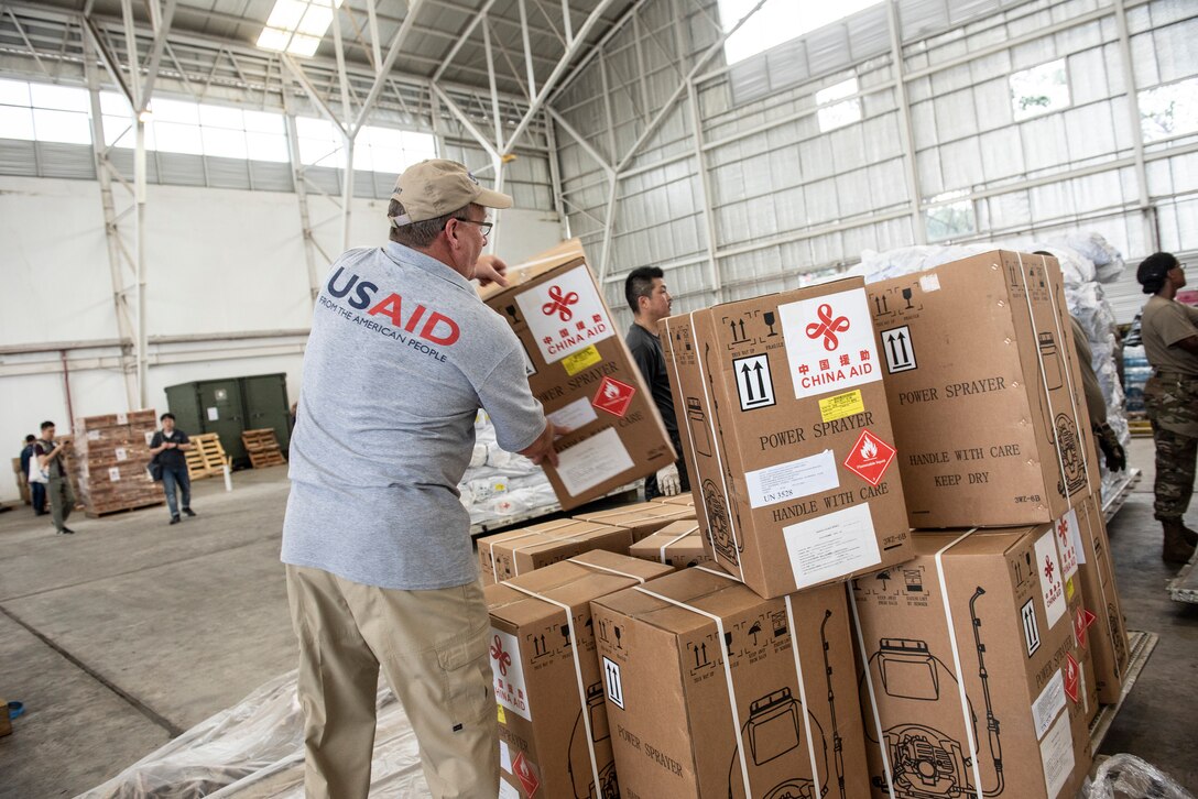 John Williamson, U.S. Agency for International Development (USAID), Office of U.S. Foreign Disaster Assistance, offloads a pallet with humanitarian supplies from China in Balikpapan, Indonesia Oct. 11, 2018. Military members assigned to the 374th Airlift Wing from Yokota Air Base, Japan and the 36th Contingency Response Group, at Andersen Air Force Base, Guam have transported and offloaded over 543,373 lbs. of humanitarian supplies in Balikpapan, as well as 255 passengers. Collectively the U.S. Air Force and, our multinational partners have downloaded 1,534,140 lbs. of cargo and transported 333 displaced people from Palu, Indonesia. (U.S. Air Force photo by Master Sgt. JT May III)