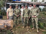 Brig. Gen. Randall Simmons, commander of the Georgia Army National Guard and Command Sgt. Major Jeff Logan, senior enlisted advisor of the 201st Regional Support Group, stand with 1st Lt. Christopher Long of the Augusta-based 877th Engineer Company and Tech Sgt. Eric Glass, Tech Sgt. Lauren Swanson and Tech Sgt. Anthony McDonnell of the Warner Robins-based 116th Air Control Wing following their emergency actions in Seminole County.