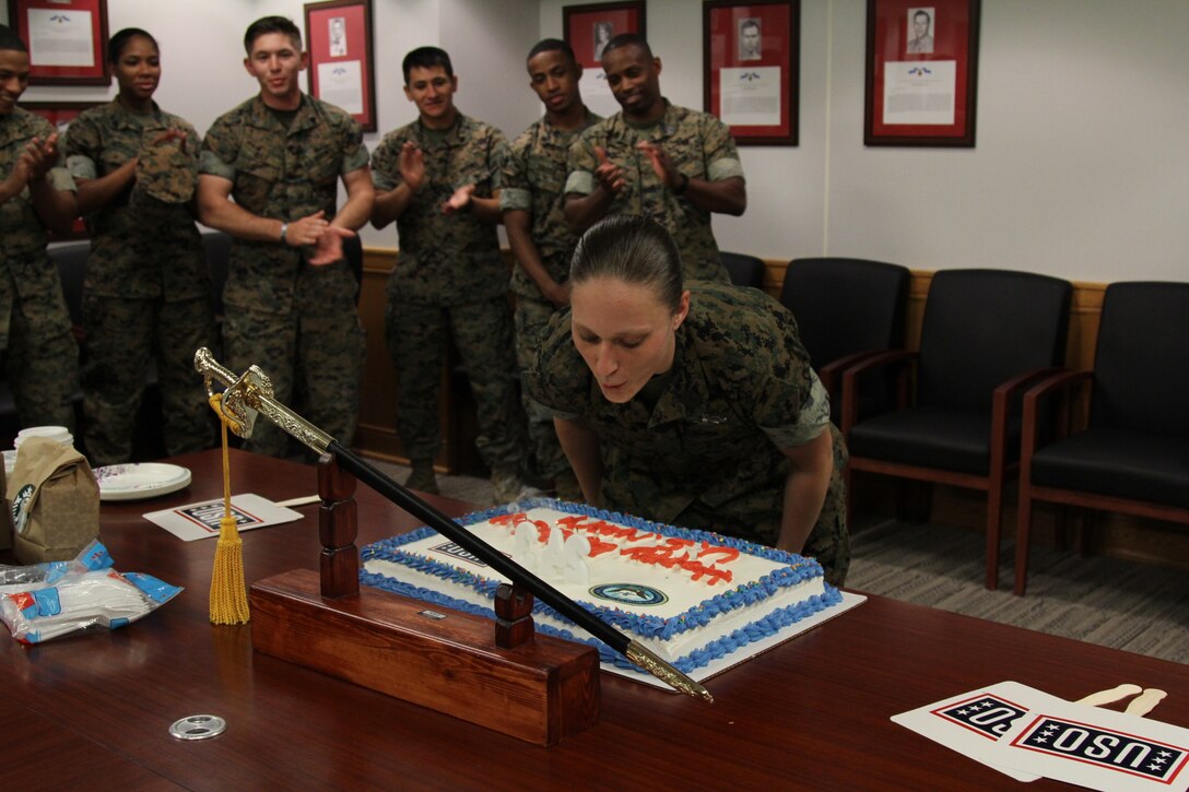 USAG CAMP HUMPHREYS, Republic of Korea – Petty Officer 1st Class Ariel Swank, medical representative for U.S. Marine Corps Forces Korea, and MARFORK staff celebrate the U.S. Navy’s birthday here, Oct. 12. MARFORK held the ceremony to recognize the legacy of the navy for its sailors as well as shared naval tradition with Marines. (U.S. Marine Corps photo by Sgt. Nathaniel Hanscom/Released)