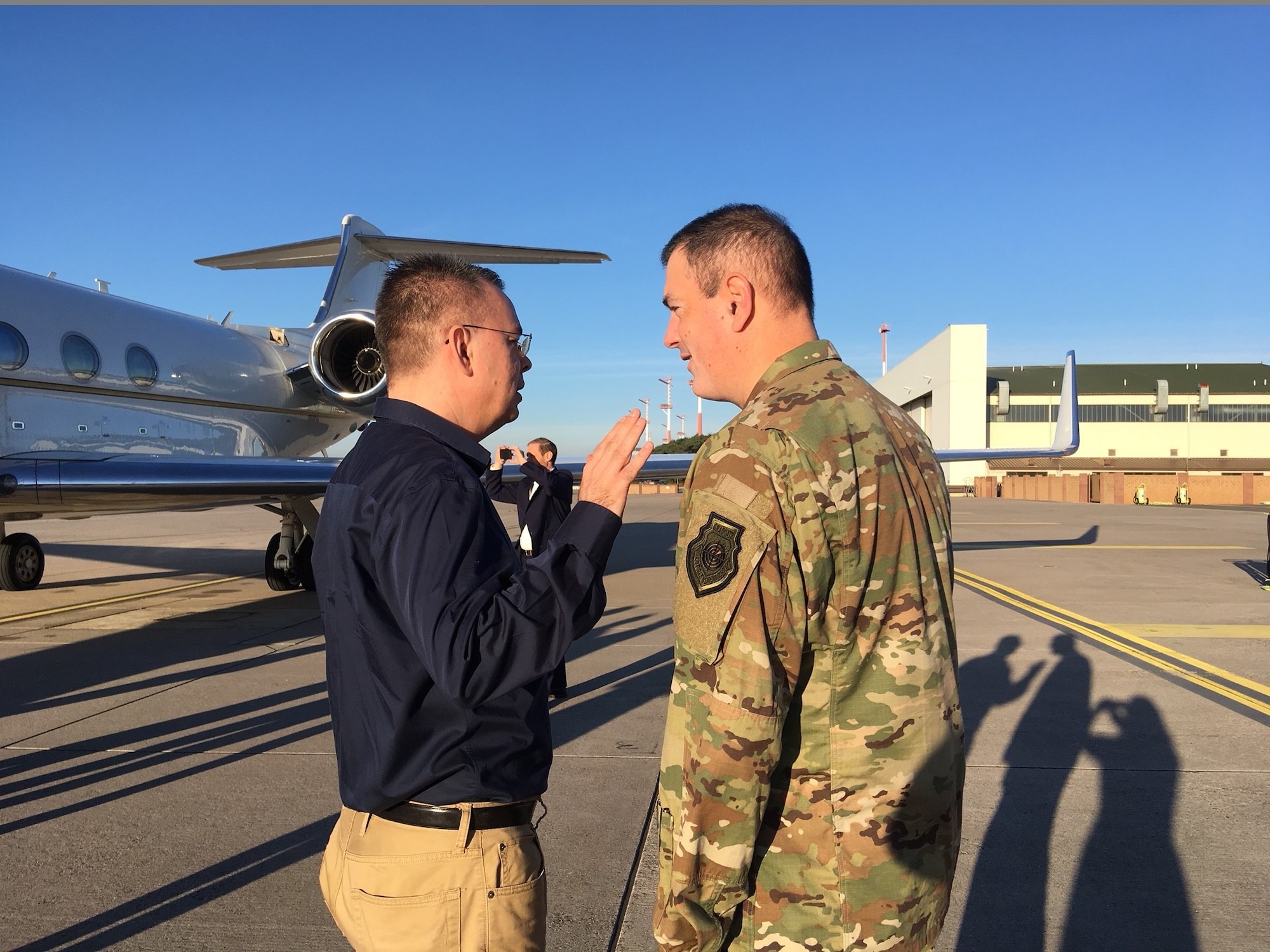 U.S. Air Force Brig. Gen. Mark R. August, 86th Airlift Wing commander, speaks with Andrew Brunson, a U.S. pastor who had been held by the Turkish judiciary for two years, during a stop on his return trip to the U.S. on Ramstein Air Base, Germany, Oct. 13, 2018. A host of Ramstein Airmen worked together to ensure Pastor Brunson's trip home went as smoothly as possible. (Courtesy photo)
