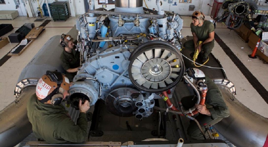 U.S. Marines with Marine Operational Test & Evaluation Squadron 1 load the main gear box of the CH-53K King Stallion onto the aircraft on Marine Corps Air Station New River, N.C., Oct. 3, 2018.