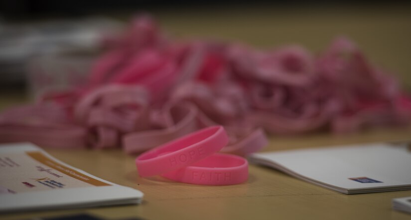 A Breast Cancer Awareness Month seminar takes place on Joint Base McGuire-Dix-Lakehurst, New Jersey, Oct. 11, 2018. The Naval Air Systems Command Women’s Advisory Group hosted the event where they provided informational pamphlets and wristbands embossed with the words hope, faith and strength. (U.S. Air Force photo by Airman First Class Ariel Owings)