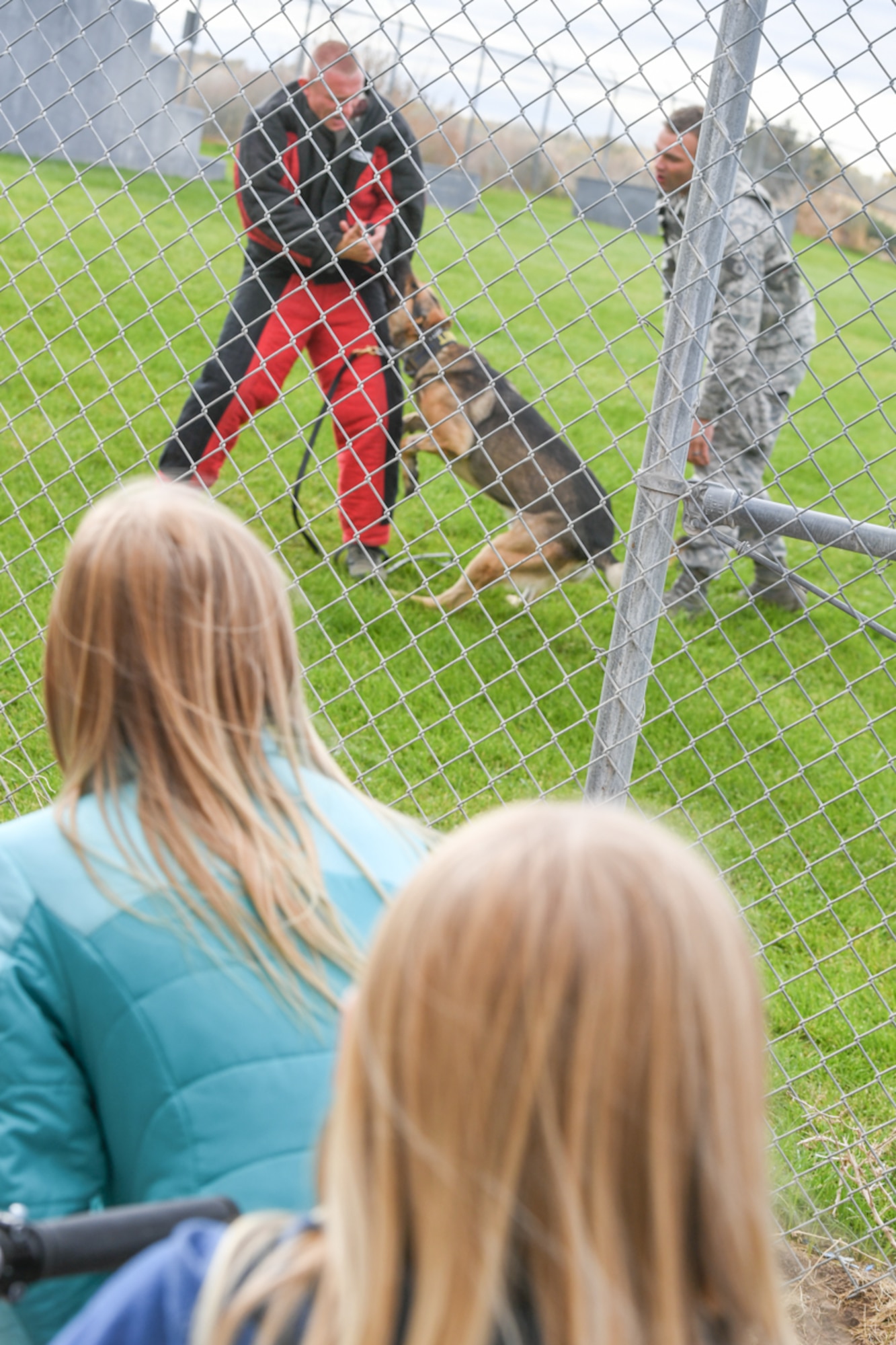 Joe, a military working dog assigned to Staff Sgt. Joseph Houseman, attacks Senior Airman Preston Ward, during a 75th Security Forces Squadron dog demonstration Oct. 11, 2018, at Hill Air Force Base, Utah. The demonstration was part of a 75th Air Base Wing-hosted base tour for Make-A-Wish Utah children and their families. (U.S. Air Force photo by Cynthia Griggs)