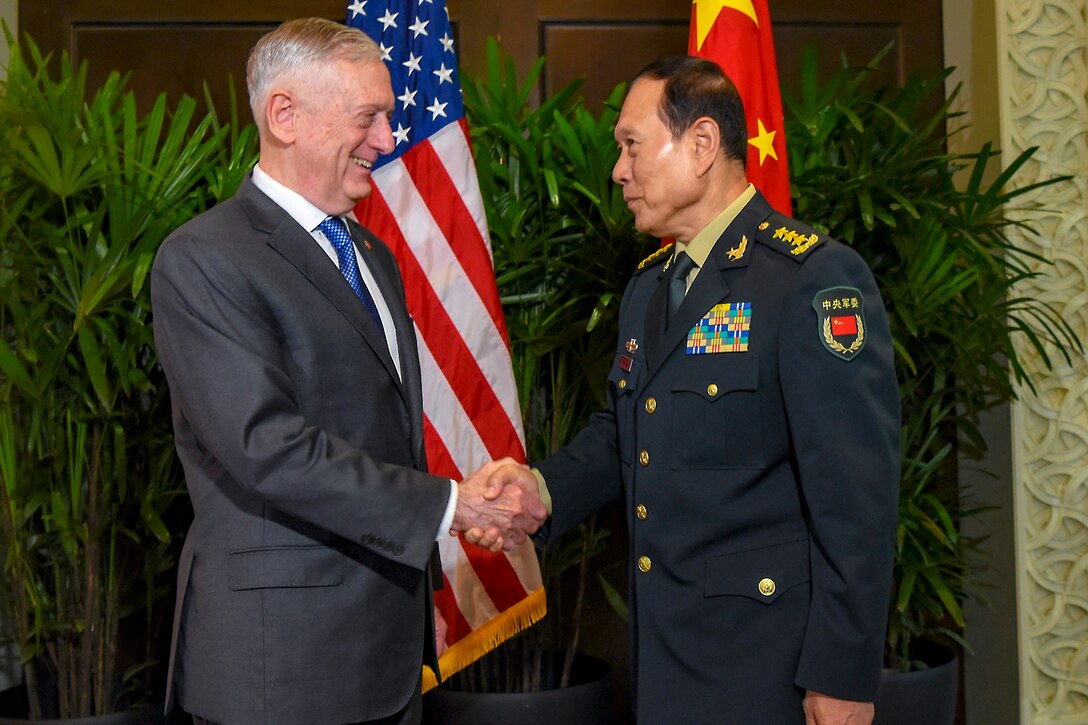 Defense Secretary James N. Mattis shakes hands with Chinese Defense Minister Gen. Wei Fenghe.
