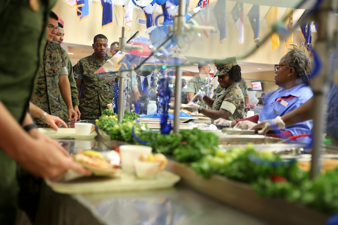 Capt. Veronica Abosi and mess hall workers serve food to Marines and Sailors during the Navy birthday celebration aboard Marine Corps Air Station Beaufort, Oct. 17. Abosi
is a supply officer with Headquarters and Headquarters Squadron aboard the air station.