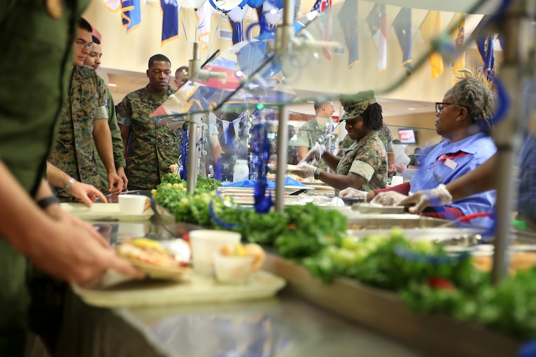 Capt. Veronica Abosi and mess hall workers serve food to Marines and Sailors during the Navy birthday celebration aboard Marine Corps Air Station Beaufort, Oct. 17. Abosi
is a supply officer with Headquarters and Headquarters Squadron aboard the air station.