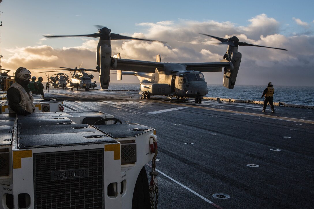 U.S. Marine Corps V-22 Osprey and CH-53 Sea Stallion prepare for takeoff aboard USS Iwo Jima (LHD 7) Oct 17, in preparation of exercise Trident Juncture 2018.