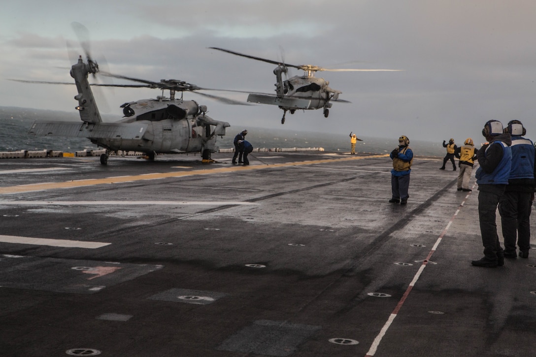 U.S. Navy H-60s conduct touch and go drills aboard USS Iwo Jima (LHD 7) Oct 17, in preparation of exercise Trident Juncture 2018.
