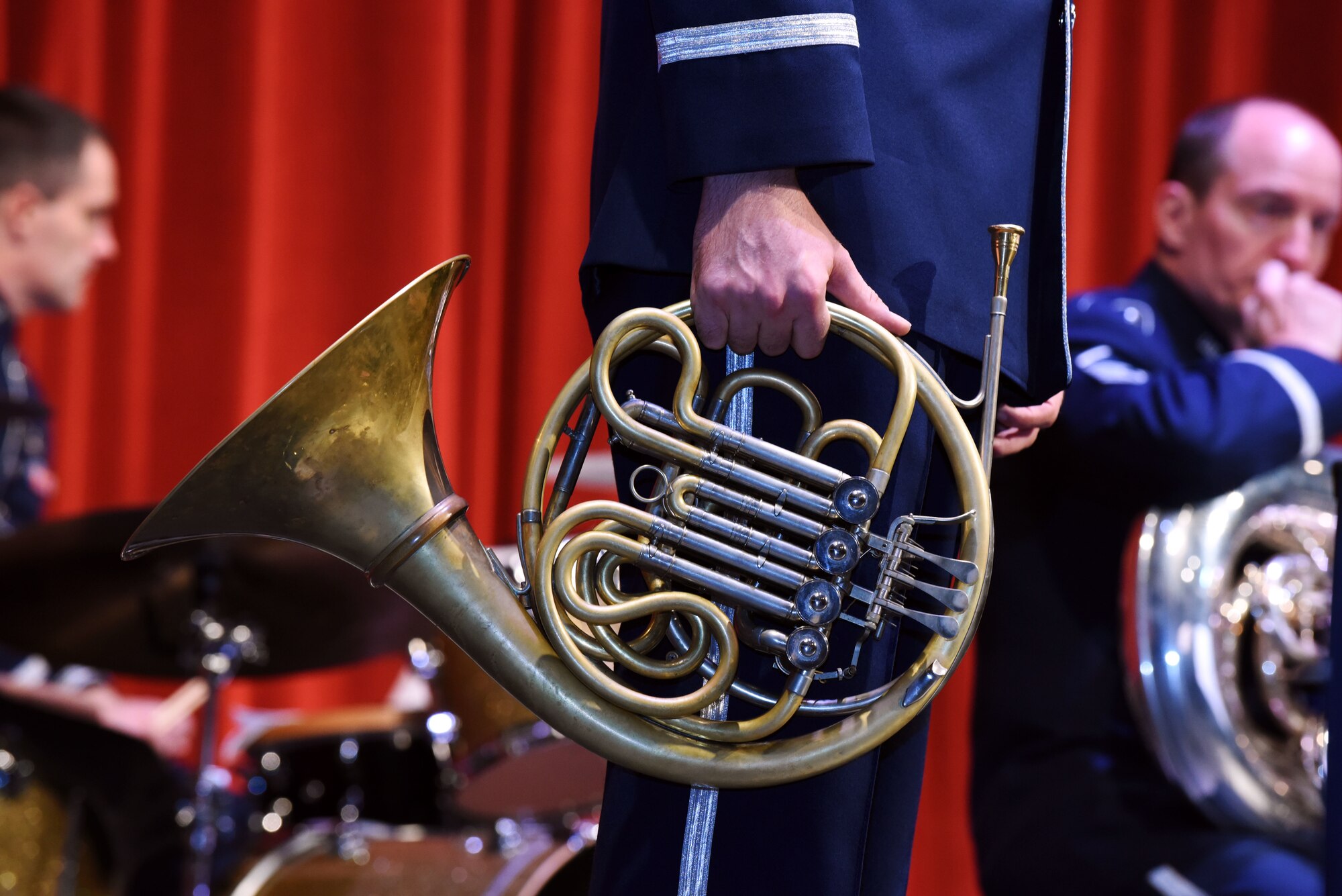 Senior Airman Nathan Owen, the Offutt Brass French horn player, waits between musical selections at the Performing Arts Center’s Historic Theater in Rapid City, S.D., Oct. 14, 2018. The band supports the Air Force mission by raising morale and communicating the Air Force story through their music. (U.S. Air Force photo by Airman Christina Bennett)