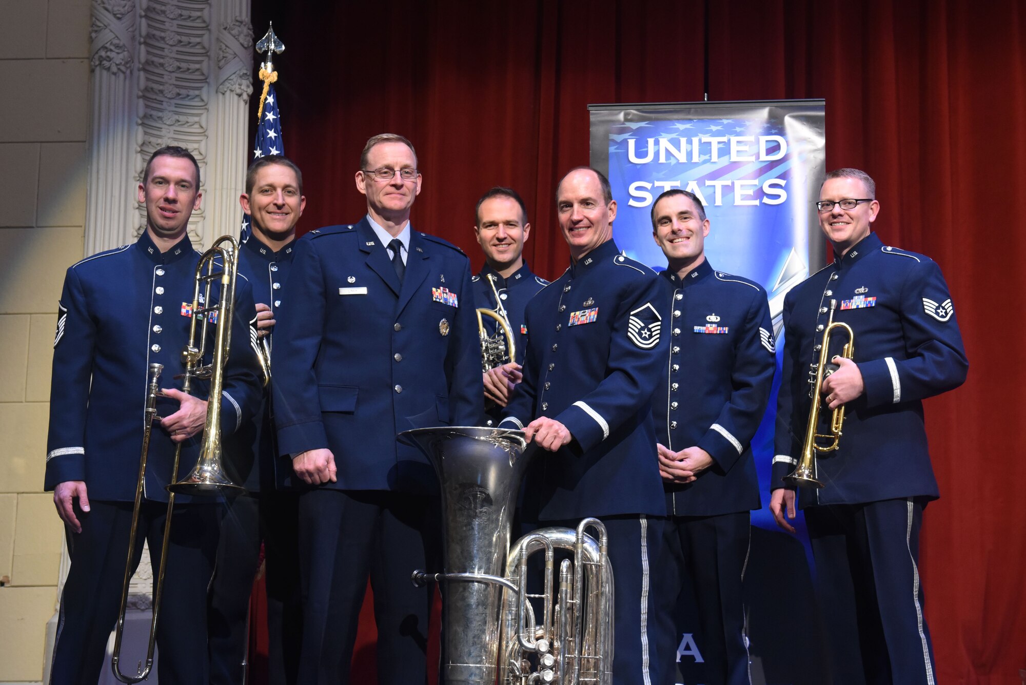 Col. David J. Linkh, the 28th Medical Group commander, stands with Offutt Brass members after their show at the Performing Arts Center’s Historic Theater in Rapid City, S.D., Oct. 14, 2018. The band supports the Air Force mission by raising morale and communicating the Air Force story through their music. (U.S. Air Force photo by Airman Christina Bennett)