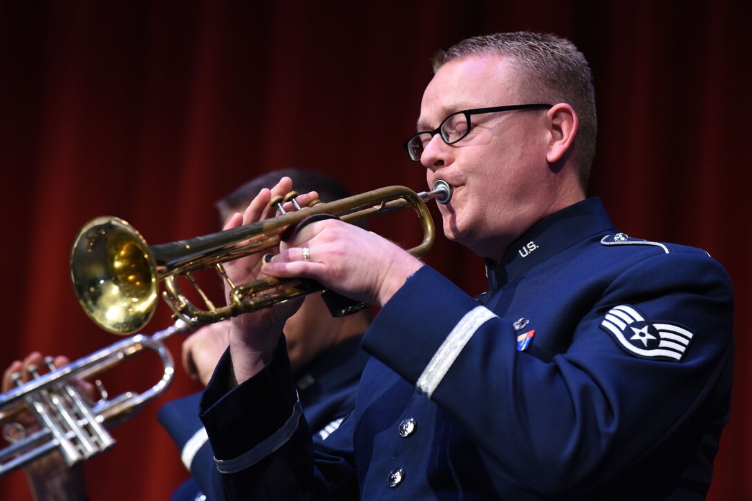 Staff Sgt. Daniel Thrower, the Offutt Brass musical director, plays a trumpet at the Performing Arts Center’s Historic Theater in Rapid City, S.D., Oct. 14, 2018. The brass band performed the musical number “Rushmore Trail,” which was composed by Thrower.  (U.S. Air Force photo by Airman Christina Bennett)