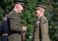 Marine Corps Gen. Joe Dunford, chairman of the Joint Chiefs of Staff, presents a Legion of Merit Award to Spain’s Chief of Defence Gen. Fernando Alejandre Martinez during an Armed Forces Full Honor Arrival Ceremony in Washington, D.C., Oct. 18, 2018.