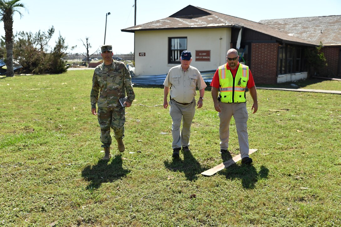 Col. Sebastien P. Joly, U.S. Army Corps of Engineers Mobile District commander, Wynne Fuller, Chief Operations Division Mobile District and Jonathan Carr, USACE Tyndall AFB resident engineer, assess the damage to the USACE Resident Office on Oct. 17, 2018 at Tyndall AFB, Fla. Hurricane Michael’s direct hit on Oct. 10, 2018 severely damaged Tyndall AFB Resident Office
