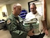 Brig. Gen. Ed â€œHertz" Vaughan, the lead for the Air Force Physiological Events Action Team, and Mr. Gerald Flowers, member of the 12th Flying Training Wing maintenance division, examine an on-board oxygen generating system (OBOGS) from a T-6 aircraft at Randolph Air Force Base, Texas. (U.S. Air Force photo by Lt. Col. Kyle Goldstein)