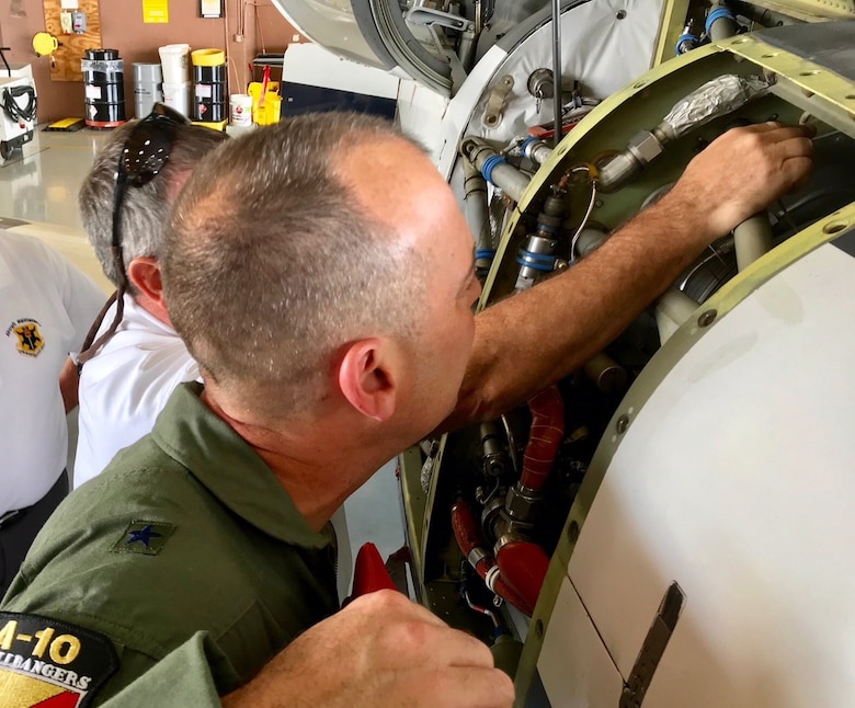 Brig. Gen. Ed “Hertz" Vaughan, the lead for the Air Force Physiological Events Action Team, and a member of the 12th Flying Training Wing maintenance division examine an on-board oxygen generating system (OBOGS) from a T-6 aircraft at Randolph Air Force Base, Texas. (U.S. Air Force photo by Lt. Col. Kyle Goldstein)