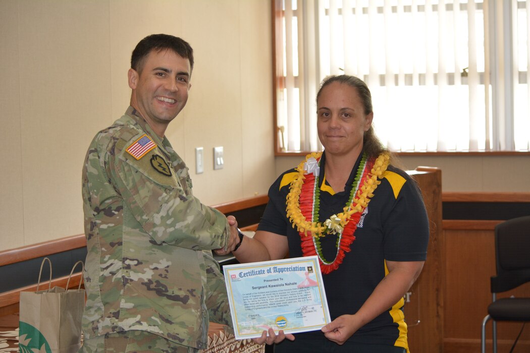 Honolulu District Deputy Commander Maj. Thomas Piazze stands with U.S. Army Reserve Sgt. Kawaiola Nahale as the guest speaker for Women's History Month.  Nahale spoke about competing in the 2016 Department of Defense Warrior Games held at the United States Military Academy at West Point, N.Y.  Based on her swim times at the trials there, she qualified to compete in both the Warrior Games and Invictus Games. Nahale is a Financial Analyst with the U.S. Army Reserve's 311th Signal Command based at Fort Shafter, Hawaii