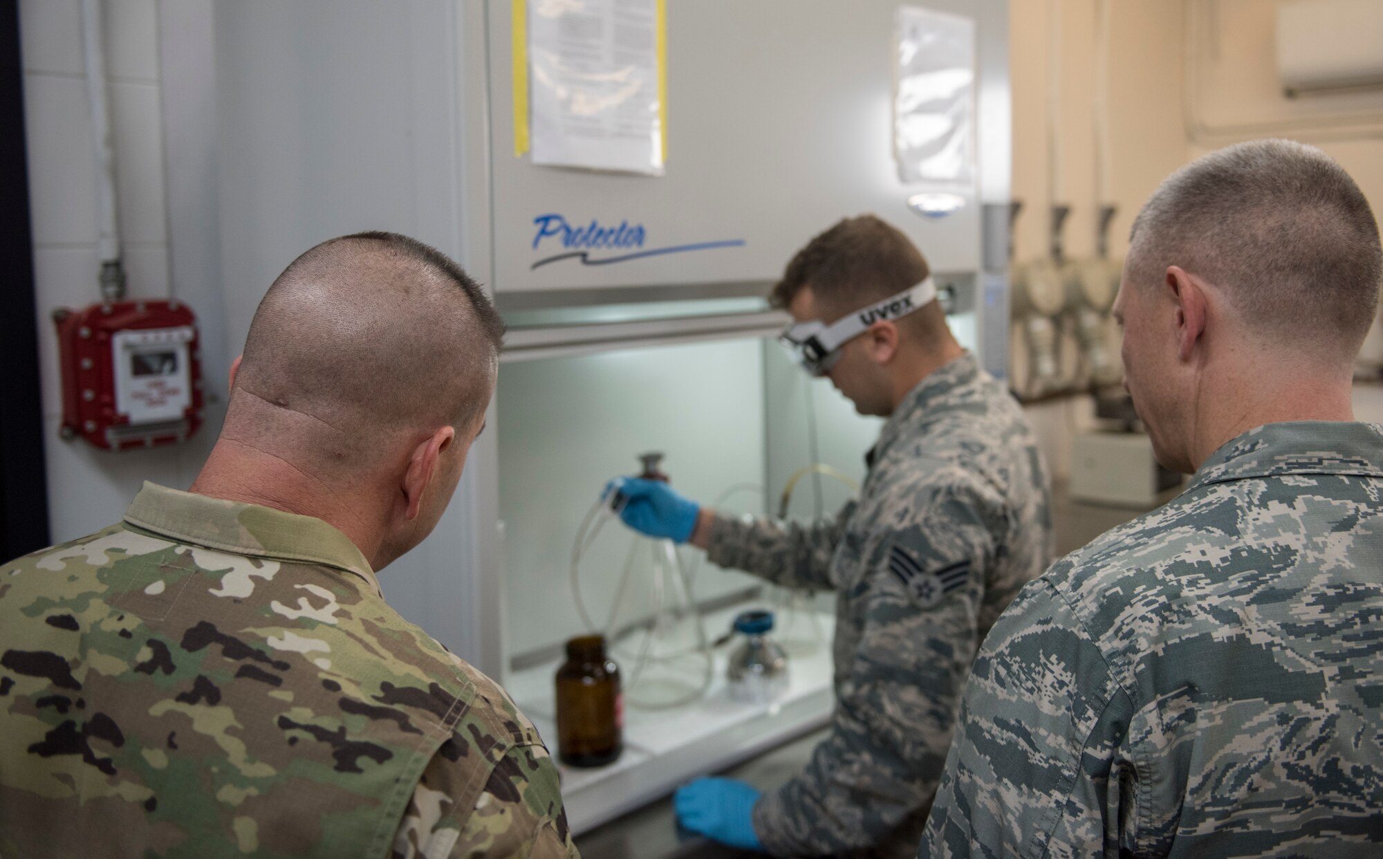 39th Logistics Readiness Squadron fuels laboratory technician briefs the 39th Air Base Wing commander and command chief.