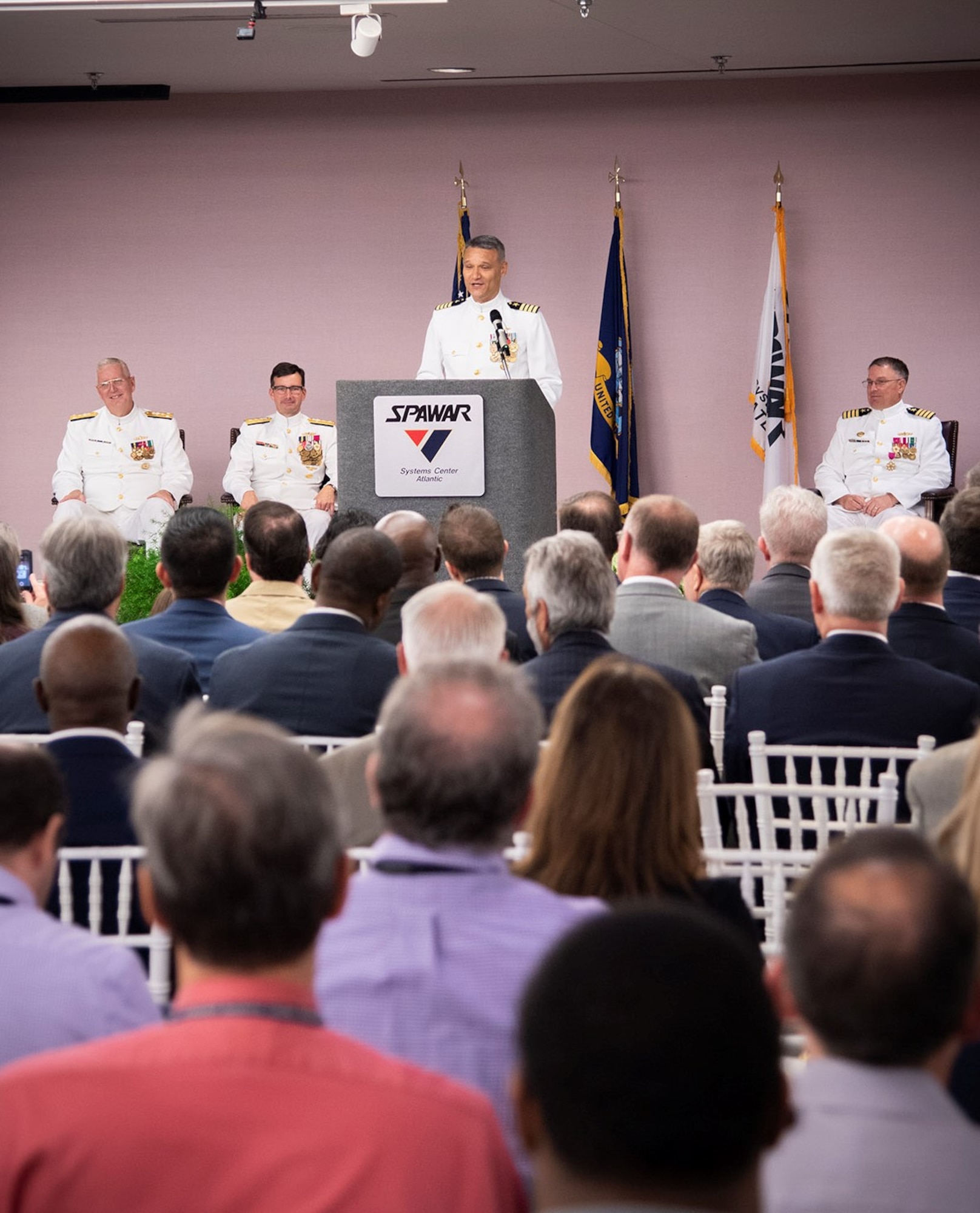Capt. Wesley Sanders speaks to attendees at Space and Naval Warfare Systems Center (SSC) Atlantic during the change of command ceremony.
