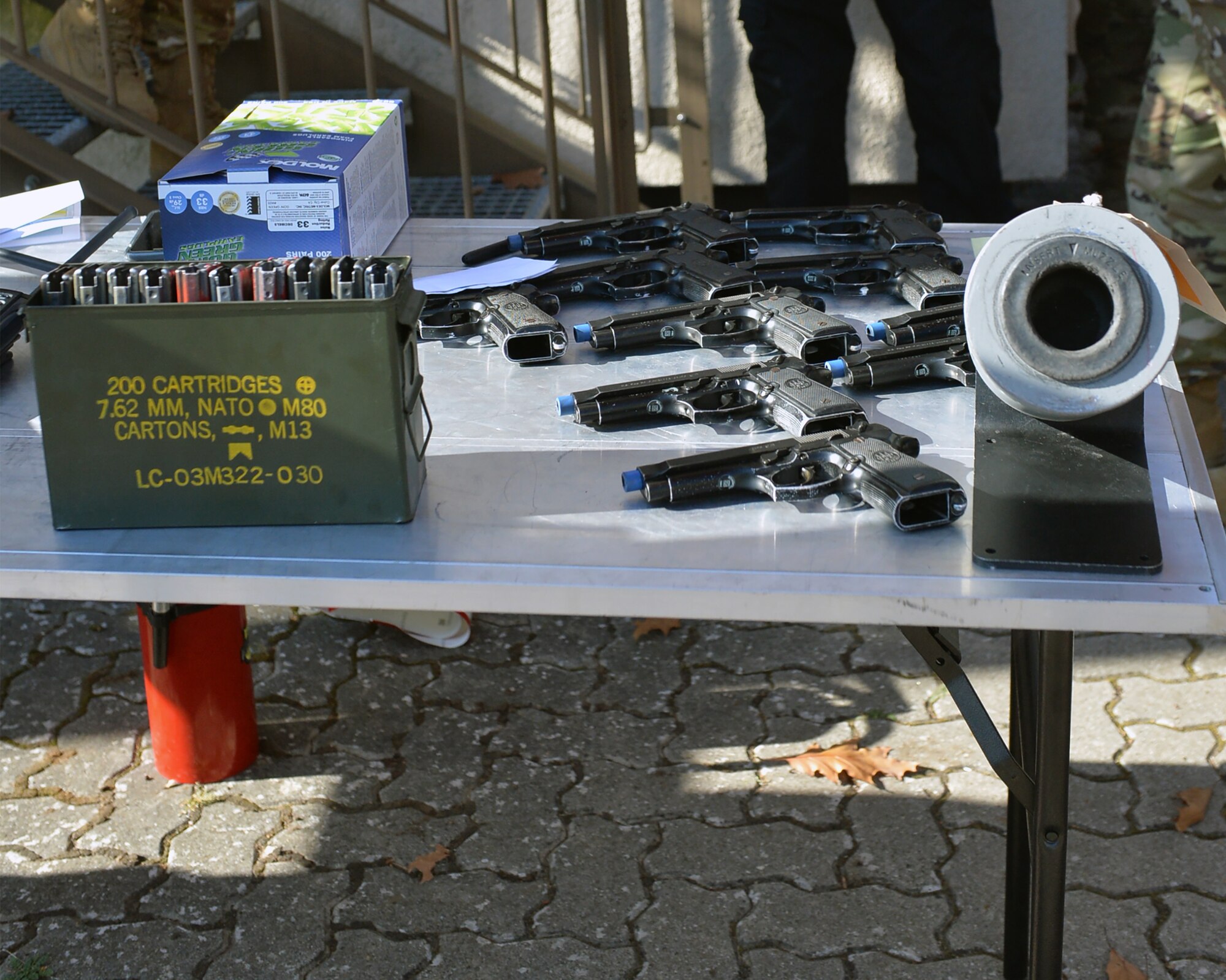 Cleared weapons sit at an entry control point for security forces teams responding to an active shooter exercise at Ramstein Airman Leadership School on Vogelweh Military Complex, Germany, Oct. 16, 2018. Teams who responded cleared out their active weapons and grabbed pre-designated safe weapons before entering the building to ensure safety of all participants. (U.S. Air Force photo by Staff Sgt. Jimmie D. Pike)