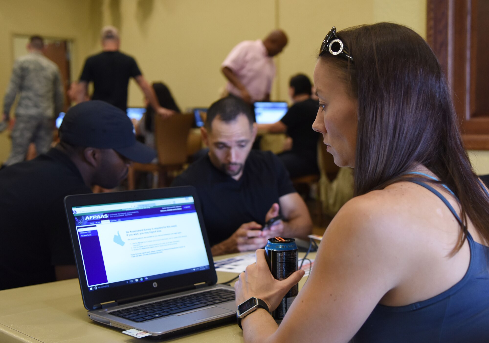 U.S. Air Force Capt. Shauna Sokolowski, 325th Medical Operations Squadron pediatric clinical nurse assigned to Tyndall Air Force Base, Florida, completes information in the Air Force Personnel Accountability and Assessment System during an open house for Hurricane Michael evacuees inside the Bay Breeze Event Center at Keesler Air Force Base, Mississippi, Oct. 16, 2018. Personnel assigned to Tyndall evacuated to Keesler in order to seek refuge from Hurricane Michael, which caused extensive destruction Oct. 10. (U.S. Air Force photo by Kemberly Groue)