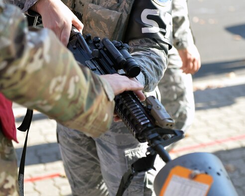 A U.S. Airman clears out his weapon during an active shooter exercise at Ramstein Airman Leadership School on Vogelweh Military Complex, Germany, Oct. 16, 2018. During the exercise safety of all participants was a primary concern. (U.S. Air Force photo by Staff Sgt. Jimmie D. Pike)