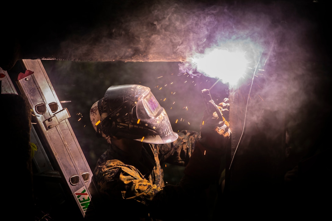 U.S. Marine Staff Sgt. Immanuel Garcia, a metal worker with Special Purpose Marine Air-Ground Task Force – Southern Command welds a support beam to support the pipe the Marines are replacing on Sep 19, 2018 in Trujillo, Honduras. The water valve was stuck at 80% shut-off effecting 6 local communities containing roughly 8,000 people. The Marines repaired the pipe to return water to the local communities. The Marines and sailors of SPMAGTF-SC are conducting security cooperation training and engineering projects alongside partner nation military forces in Central and South America. The unit is also on standby to provide humanitarian assistance and disaster relief in the event of a hurricane or other emergency in the region.