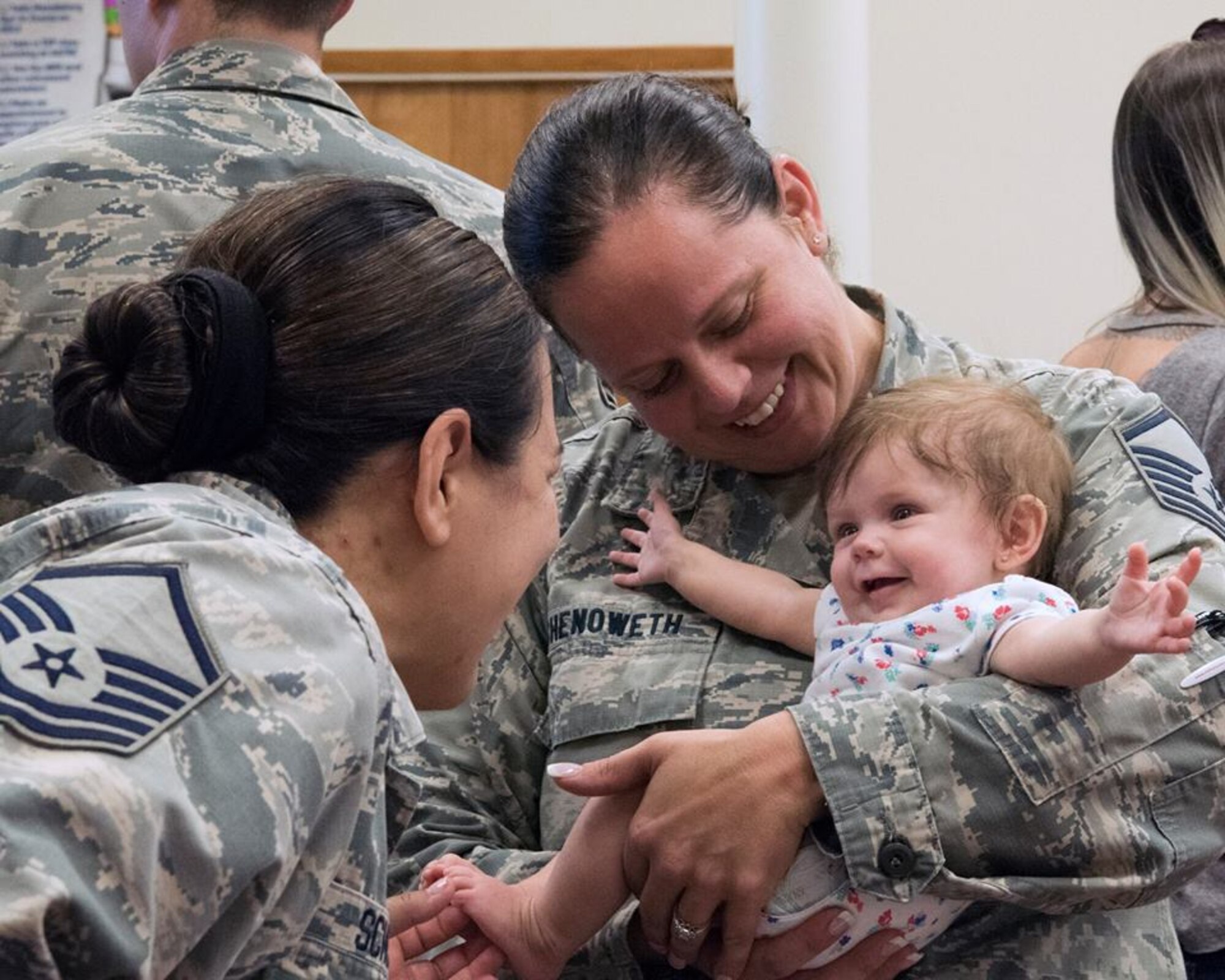Master Sgt. Angela Chenoweth, Airman and Family Readiness NCO in charge, holds a child from a Tyndall Air Force Base, Fla. family during an Emergency Family Assistance Center at Patrick Air Force Base, Fla. on Oct. 17, 2018. The EFAC provided a forum to connect Tyndall AFB families displaced by Hurricane Michael with Patrick AFB agencies.