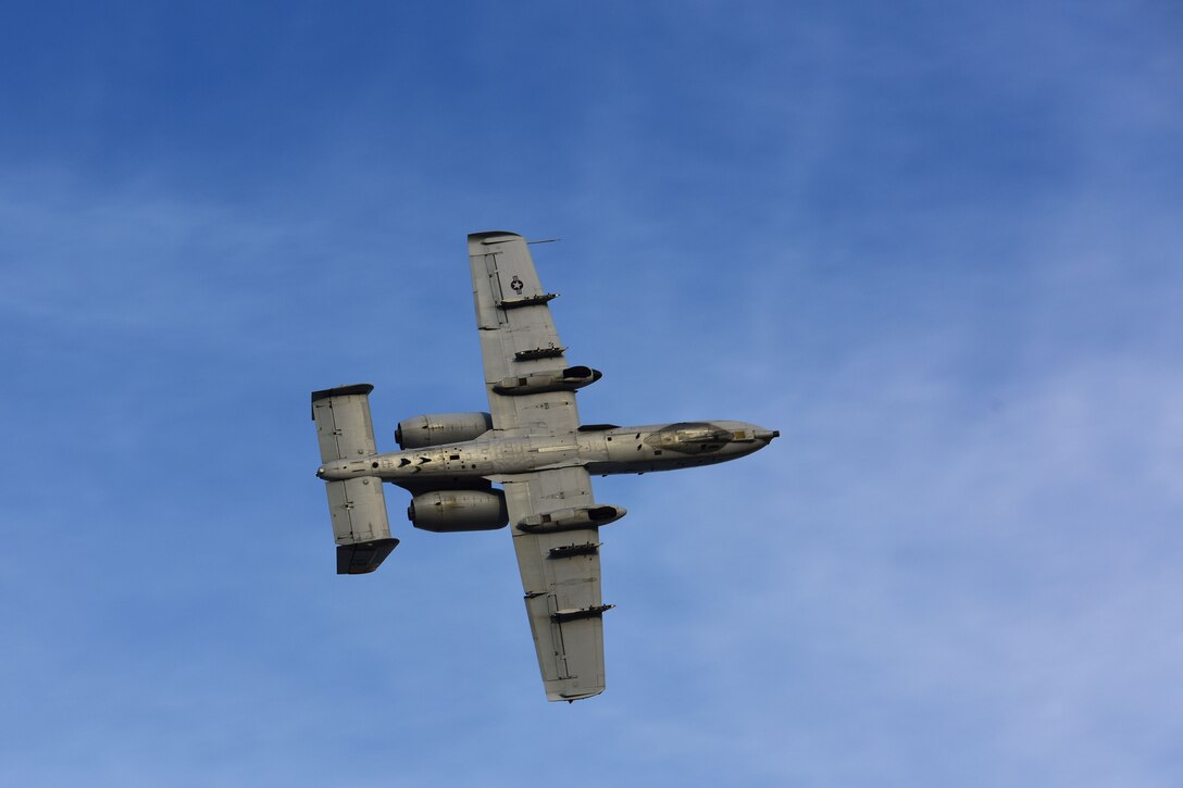An A-10 Thunderbolt II performs aerial maneuvers before the start of a Fallen Hawg remembrance ceremony Oct. 17, 2018, at Whiteman Air Force Base, Mo. The remembrance ceremony was held in honor of fallen A-10 pilots and signals the start of 2018 Hawgsmoke competition, which is a biennial worldwide A-10 bombing, missile and tactical gunnery competition derived from the discontinued "Gunsmoke" Air Force Worldwide Gunnery Competition. (U.S. Air Force photo by Staff Sgt. Joel Pfiester)