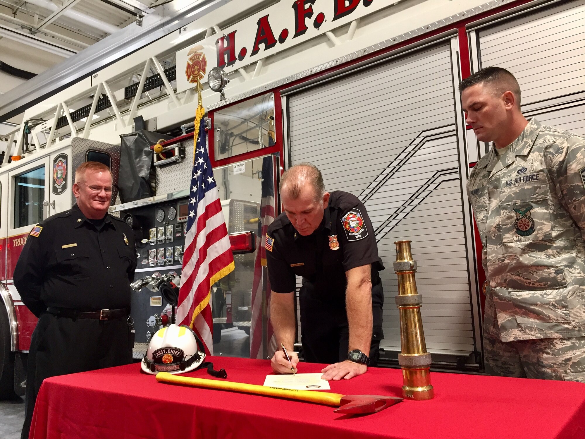 Brian Anderson, Hill deputy fire chief, signs a Fire Prevention Week proclamation Oct. 8, 2018, at Hill Air Force Base, Utah. (Courtesy photo)