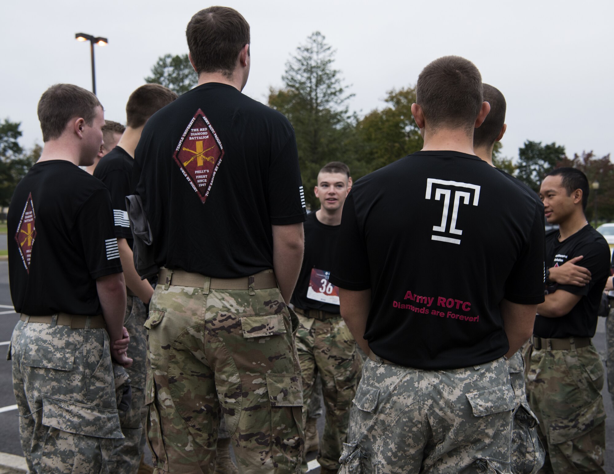 Cadets with Temple University’s Red Diamond Battalion Army ROTC talk amongst each other before the 12th Annual Gold Star Ruck March on Joint Base McGuire-Dix-Lakehurst, New Jersey, Oct. 6, 2018. The cadets volunteered to represent one of the families from Gold Star Families for Peace. (U.S. Air Force photo by Airman First Class Ariel Owings)